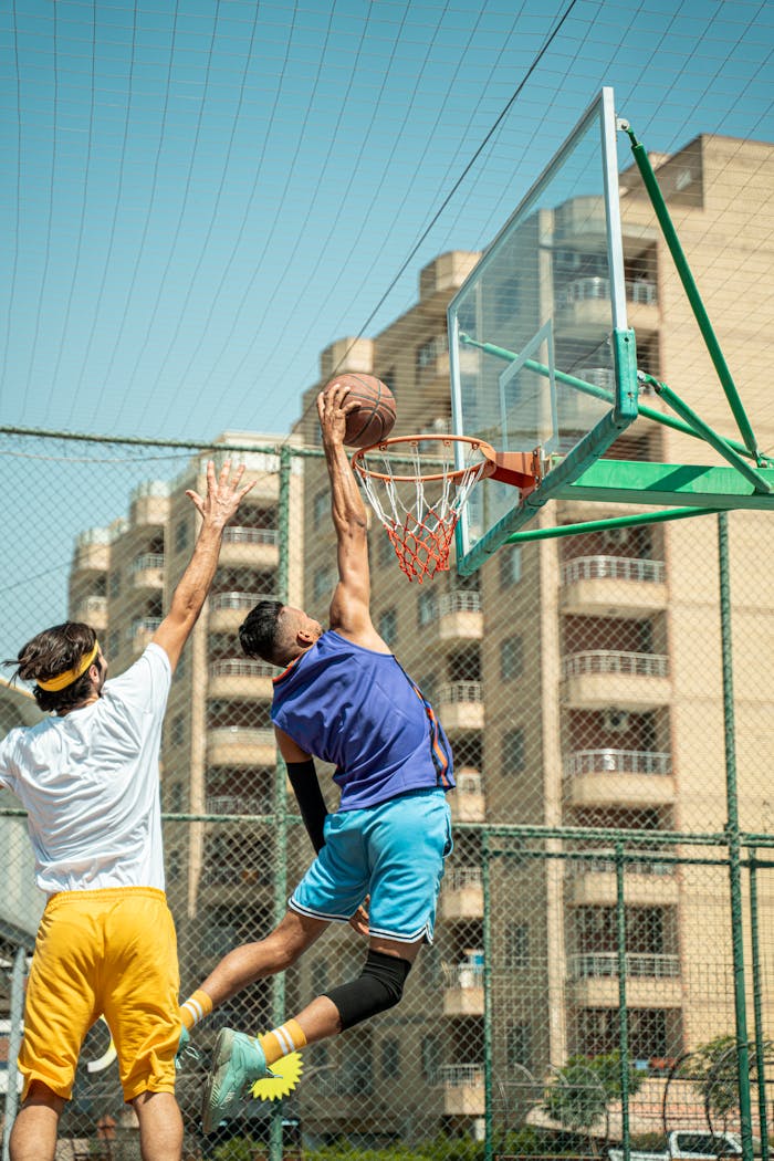 services-01 Dynamic basketball scene with players in action on an urban court in Baghdad.